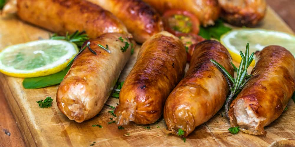 cooking pork sausages in the oven and pork steaks in a pan